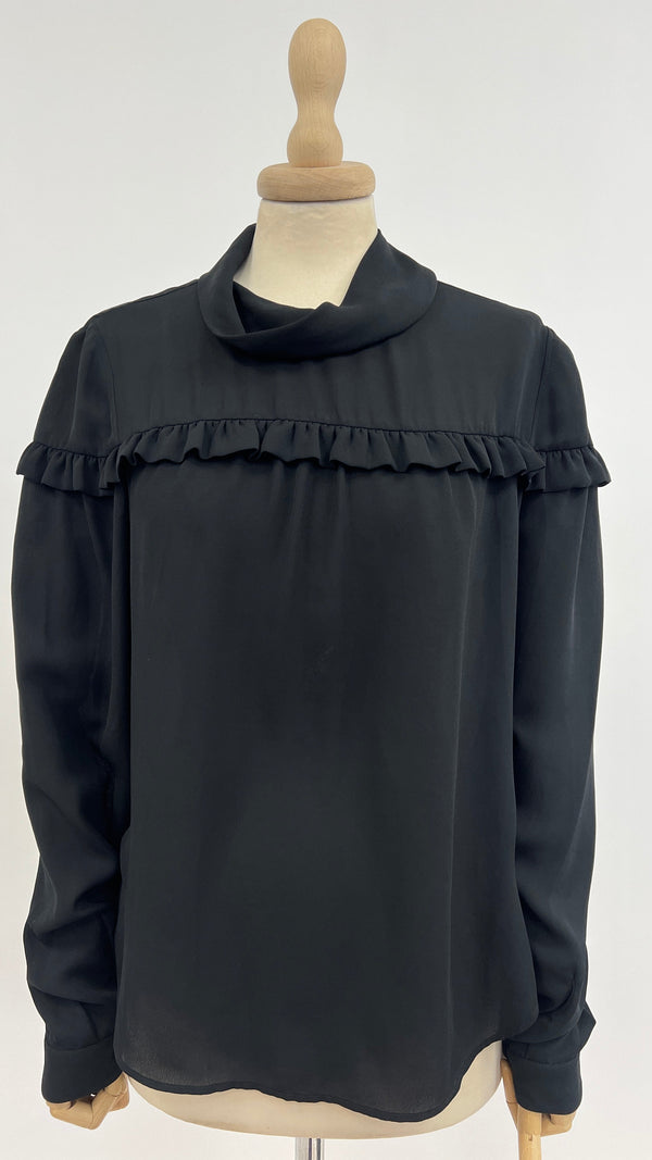 Blusa con balza