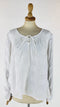 Blusa con laccetti al collo