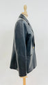 Blazer in pelle con spilla