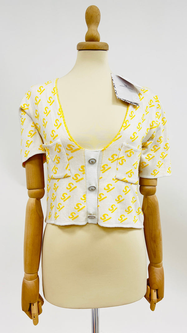 Cardigan corto con cartellino