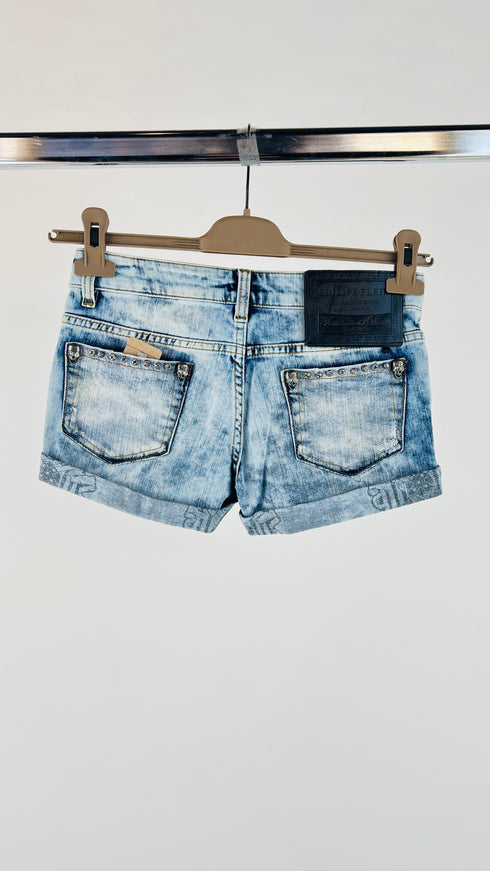 Shorts denim bleach con appliqués