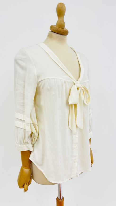 Camicia fiocco con cartellino