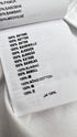 T-shirt basica con cartellino