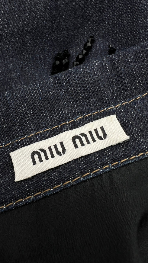 Smanicato in denim con frange