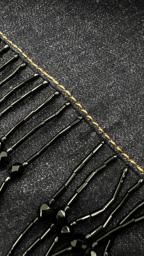 Smanicato in denim con frange