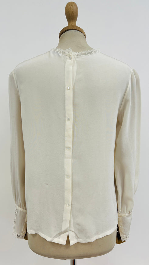 Blusa collo ricamo