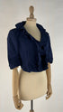 Bolero blu con cartellino