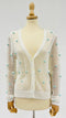 Cardigan a rete con pon-pon