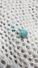 Cardigan a rete con pon-pon DORosi